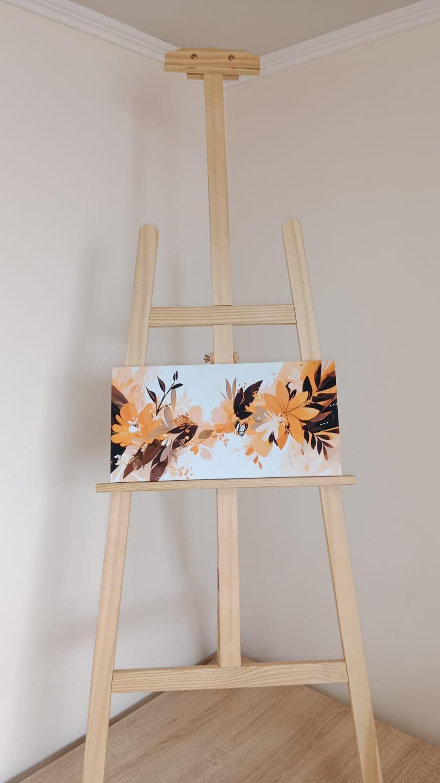 Cuadro decorativo floral horizontal en tonos cálidos sobre atril