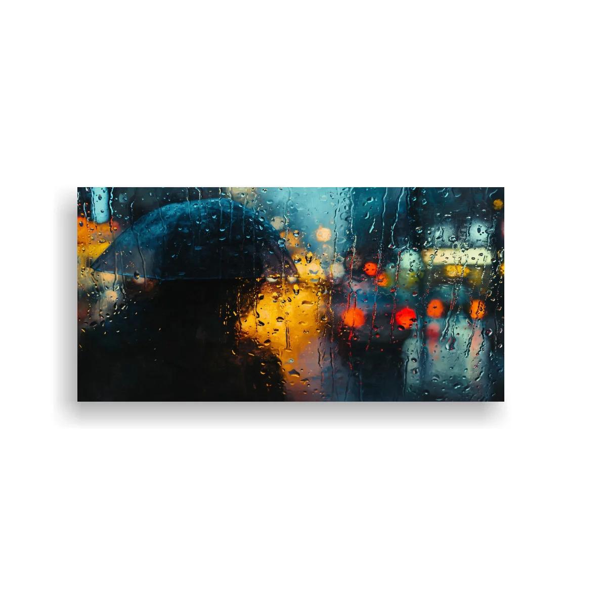 Cuadro persona con paraguas negro bajo la lluvia y luces borrosas