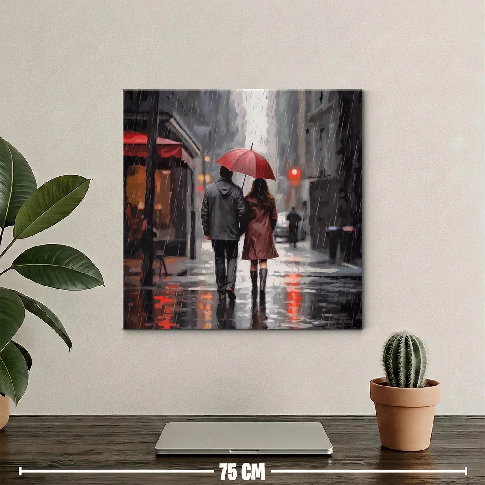 Pareja caminando bajo la lluvia con paraguas rojo — miniatura 2