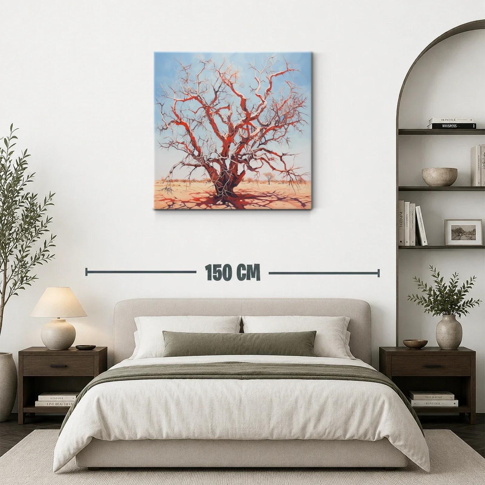 Árbol seco rojizo bajo cielo azul claro en paisaje árido — miniatura 3