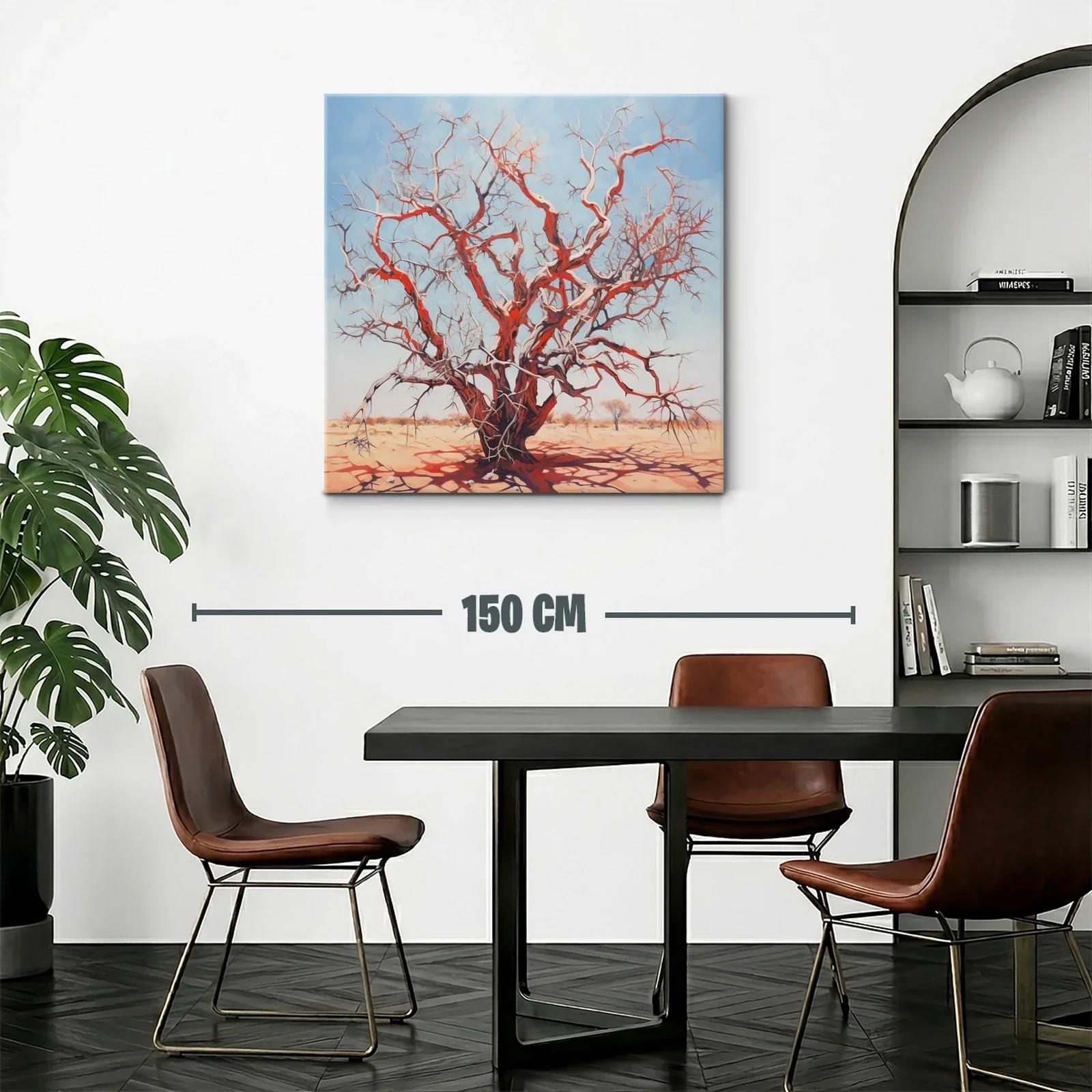 Árbol seco rojizo bajo cielo azul claro en paisaje árido — miniatura 2