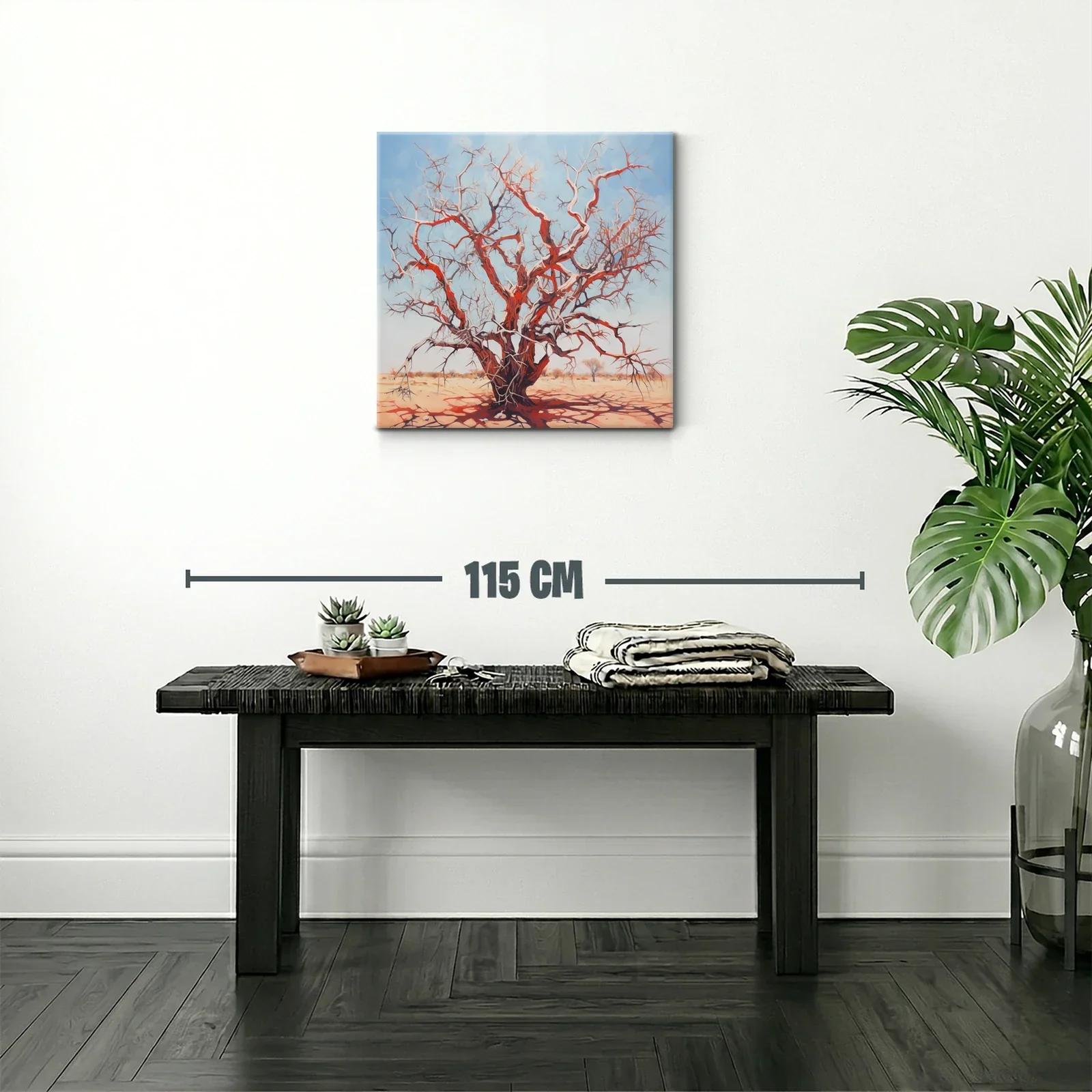 Árbol seco rojizo bajo cielo azul claro en paisaje árido — miniatura 2